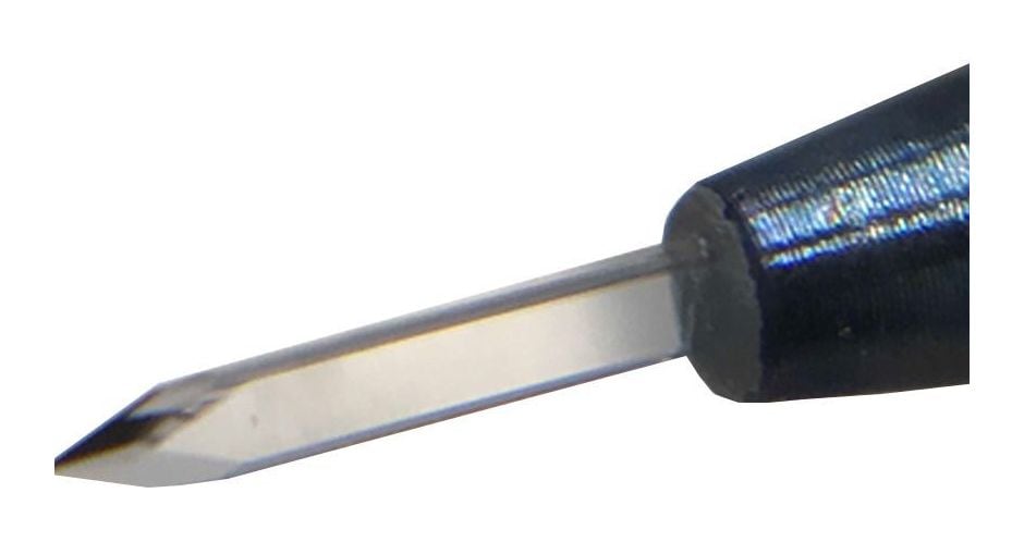 Close-up of a sapphire blade tip showing the ground cutting edge and the crystal shank entering the holder.